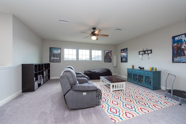 living room with light colored carpet and ceiling fan