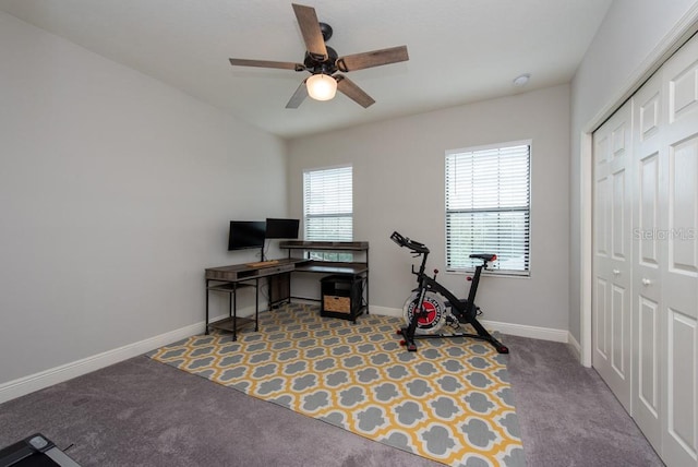 office space with light colored carpet and ceiling fan