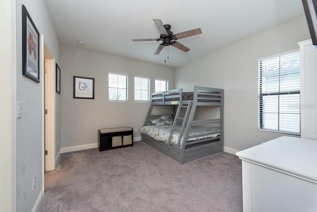 bedroom with ceiling fan and light colored carpet