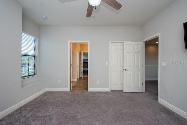 unfurnished bedroom with ceiling fan, a closet, and carpet floors