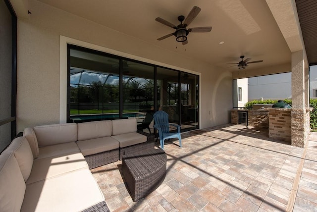 view of patio / terrace featuring ceiling fan, area for grilling, a lanai, and an outdoor hangout area