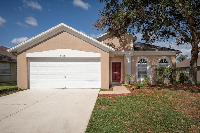 single story home with a front yard and a garage