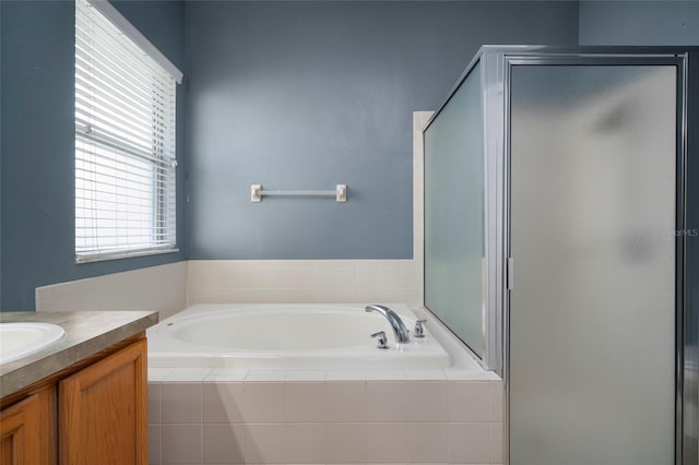 bathroom featuring vanity and plus walk in shower