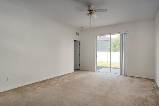 unfurnished room featuring light carpet and ceiling fan