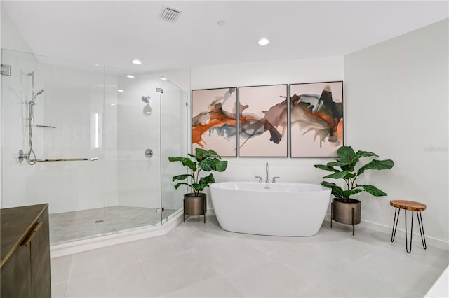 bathroom with vanity, shower with separate bathtub, and tile patterned floors