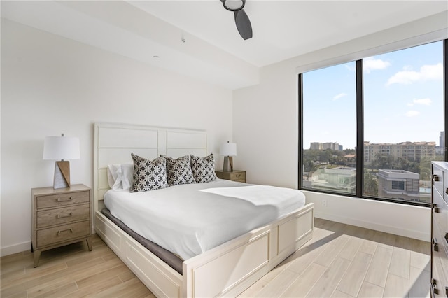 bedroom featuring light hardwood / wood-style flooring and ceiling fan