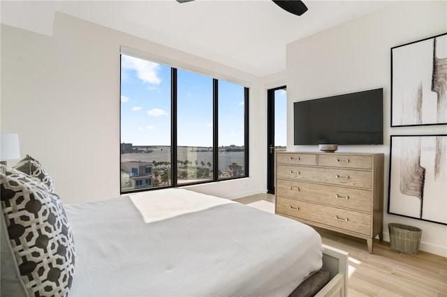 bedroom featuring light hardwood / wood-style flooring and ceiling fan