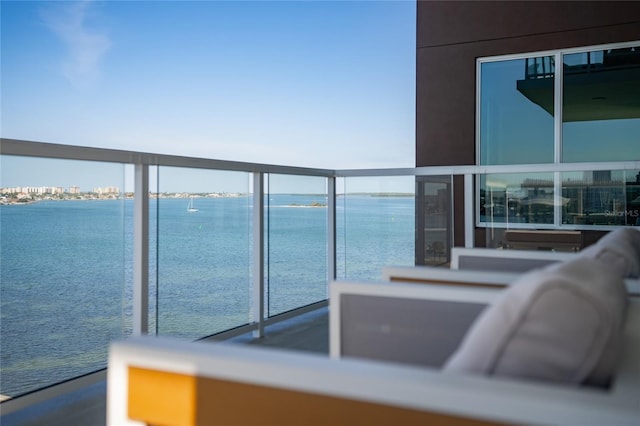 balcony featuring a water view