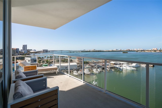 balcony featuring a water view