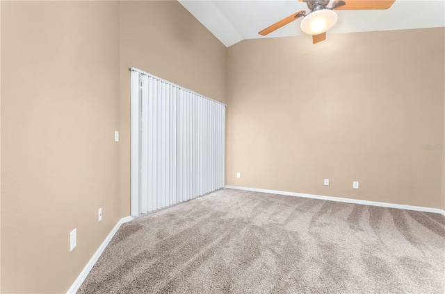 spare room featuring high vaulted ceiling, carpet, baseboards, and ceiling fan