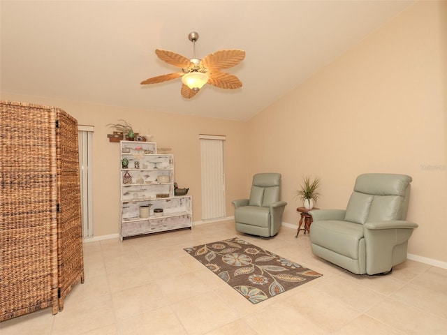 sitting room with light tile patterned flooring, ceiling fan, and lofted ceiling