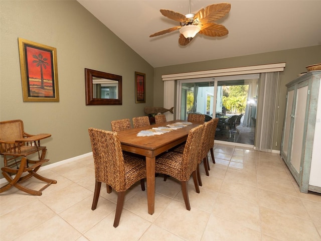 tiled dining area featuring ceiling fan and lofted ceiling