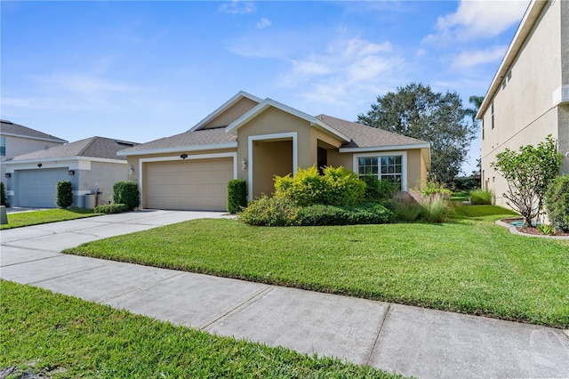 single story home with a garage and a front lawn