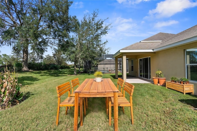 view of yard with a patio and a lanai