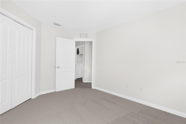 unfurnished bedroom with a closet and carpet floors