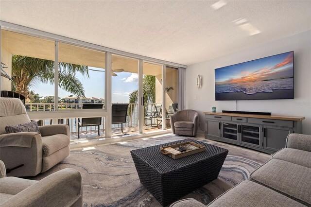 5281 Isla Key Blvd S Unit 206, Saint Petersburg, FL 33715 - living area featuring floor to ceiling windows and a textured ceiling