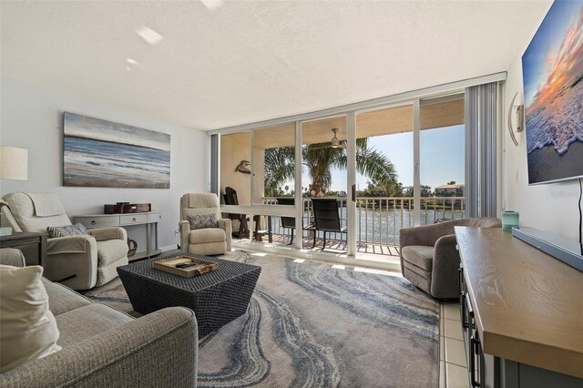 5281 Isla Key Blvd S Unit 206, Saint Petersburg, FL 33715 - living room featuring expansive windows and a textured ceiling