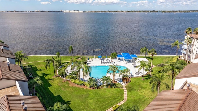 birds eye view of property with a water view