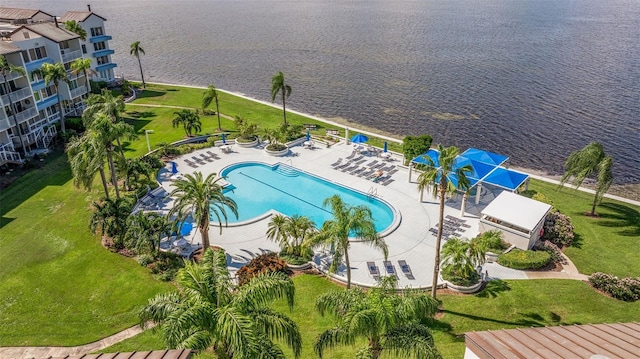 birds eye view of property with a water view