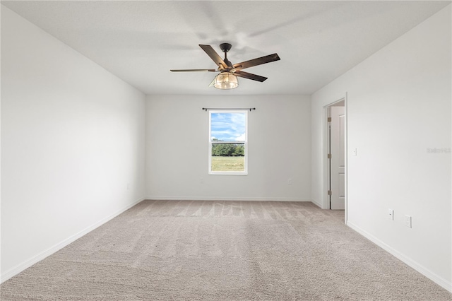 empty room with light carpet and ceiling fan