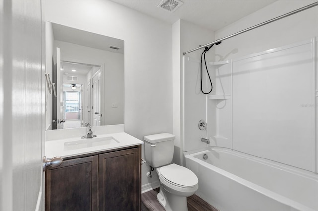 full bathroom featuring toilet, vanity, shower / bathtub combination, and hardwood / wood-style floors