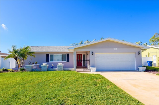 single story home featuring a garage and a front yard