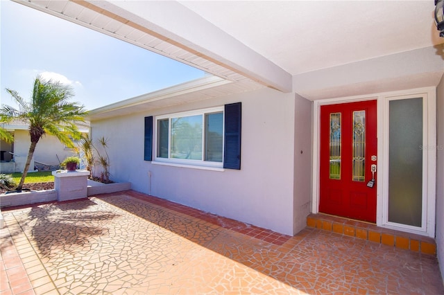 doorway to property featuring a patio