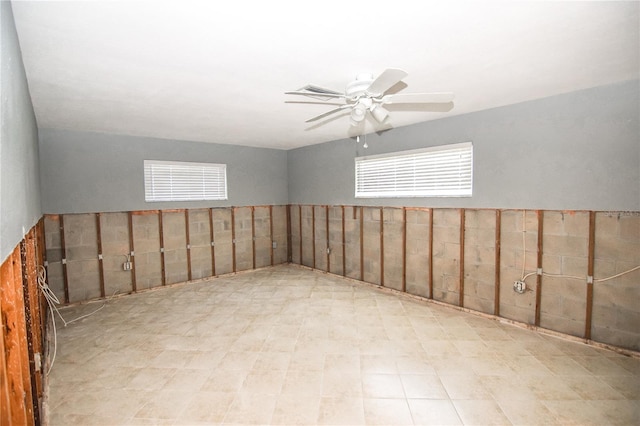 additional living space featuring ceiling fan