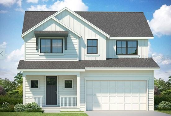 view of front of home featuring a front yard, a porch, and a garage