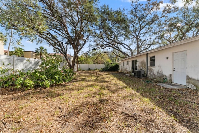 view of yard featuring central AC unit