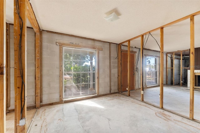 miscellaneous room with a textured ceiling