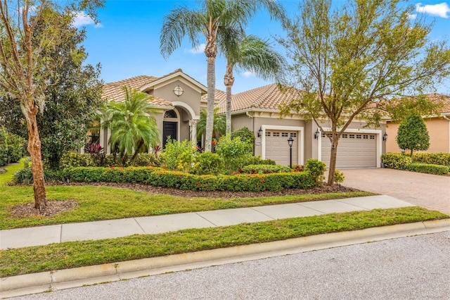 mediterranean / spanish-style house featuring a garage