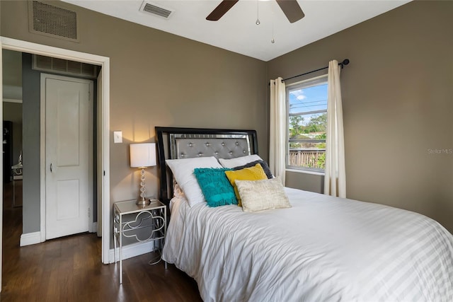 bedroom featuring ceiling fan and dark hardwood / wood-style floors