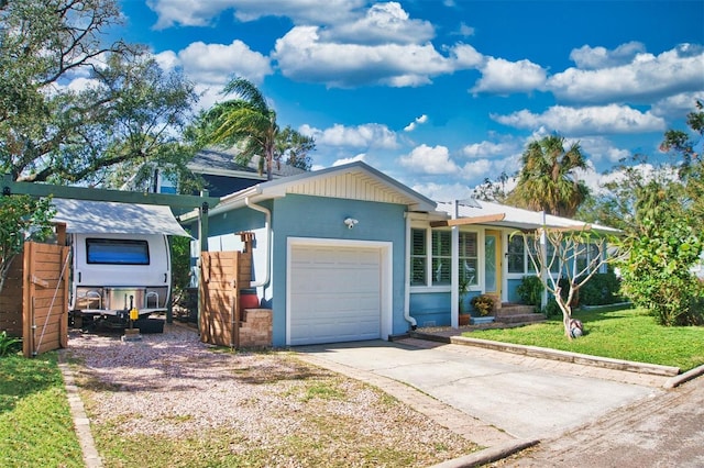 view of front of home featuring a front lawn and a garage