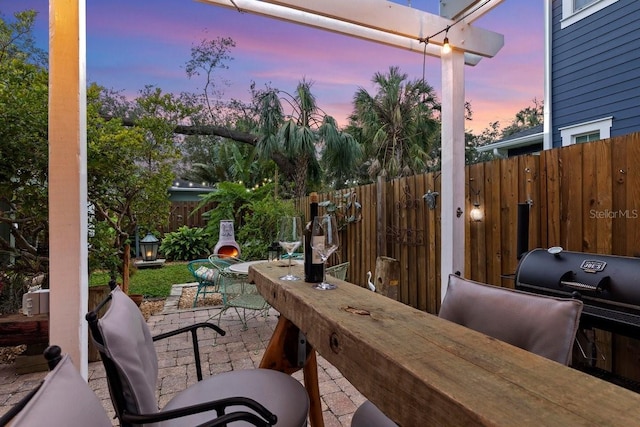 patio terrace at dusk with grilling area