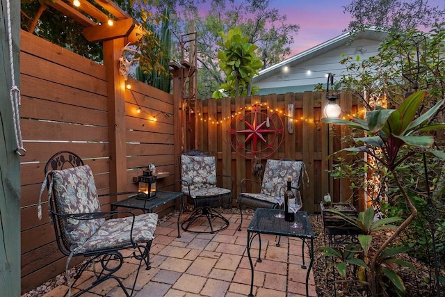 view of patio terrace at dusk