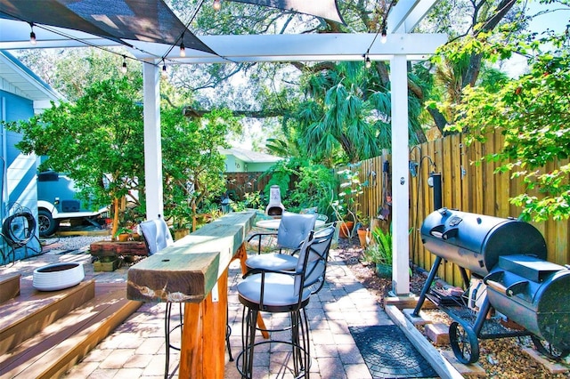 view of patio featuring a grill