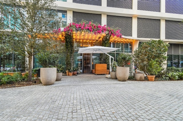 1000 Water St Unit 1702, Tampa, FL 33602 - view of exterior entry with a patio and a carport