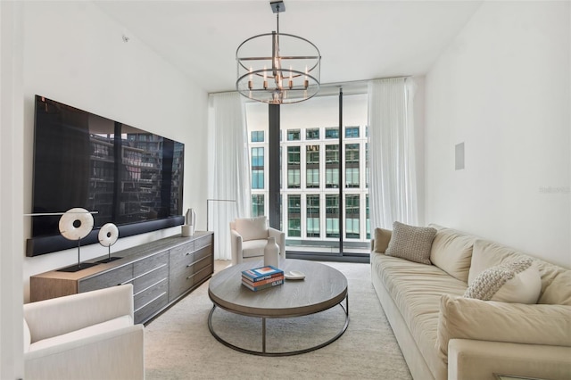 living room with a wall of windows and a notable chandelier