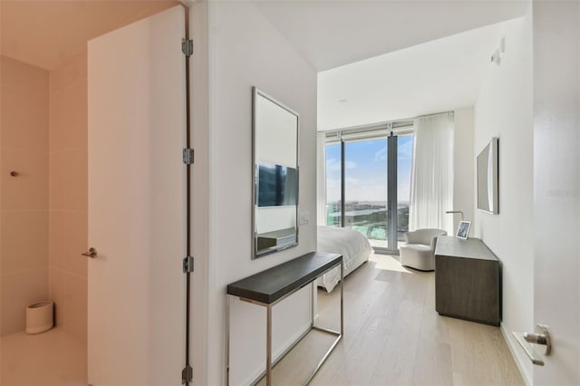 1000 Water St Unit 1702, Tampa, FL 33602 - bedroom featuring access to outside and light wood-style flooring
