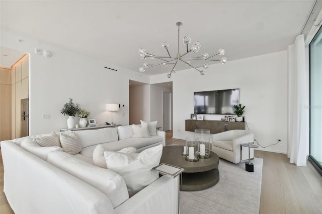 1000 Water St Unit 1702, Tampa, FL 33602 - living area featuring light wood-type flooring and a chandelier