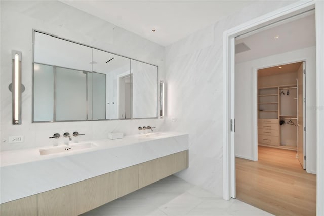 bathroom featuring vanity and hardwood / wood-style floors