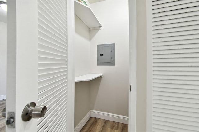 spacious closet featuring dark wood-type flooring and electric panel