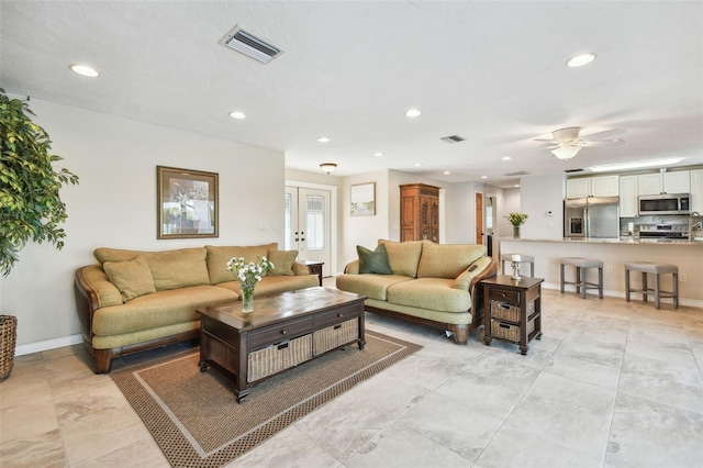 living room with ceiling fan