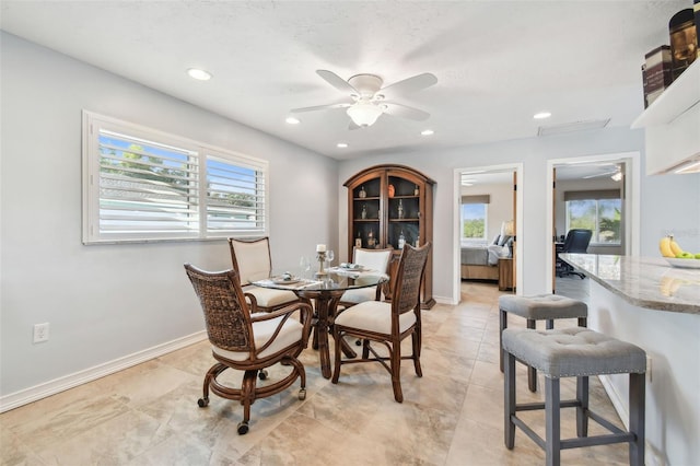 dining space with ceiling fan