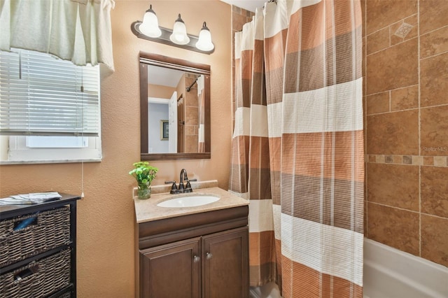 bathroom featuring vanity and shower / tub combo