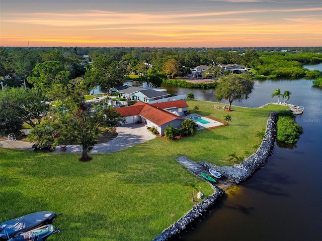 aerial view at dusk with a water view