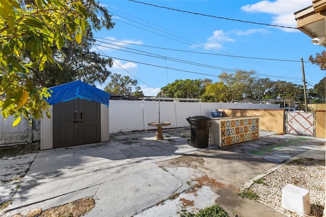 view of patio / terrace with a storage shed