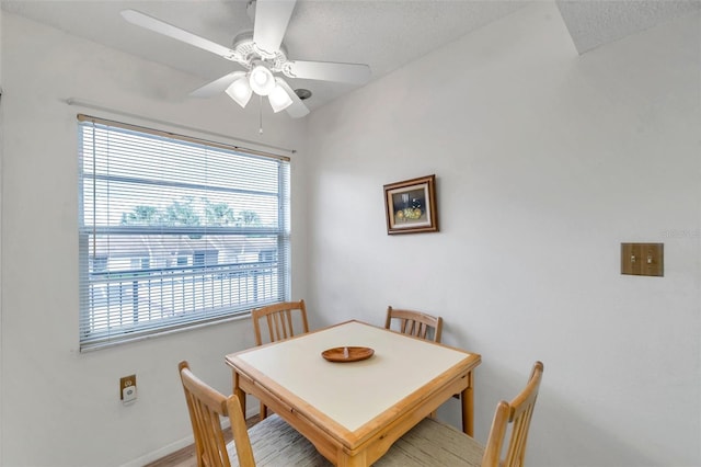 dining room featuring ceiling fan