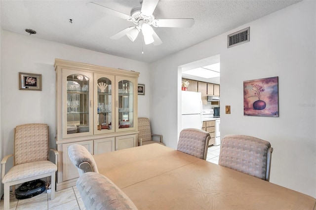 3840 Staysail Ln Unit 3840, Holiday, FL 34691 - dining space featuring light tile patterned floors and a ceiling fan